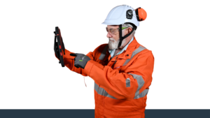 Technician using a rugged tablet for industrial inspection and compliance monitoring
